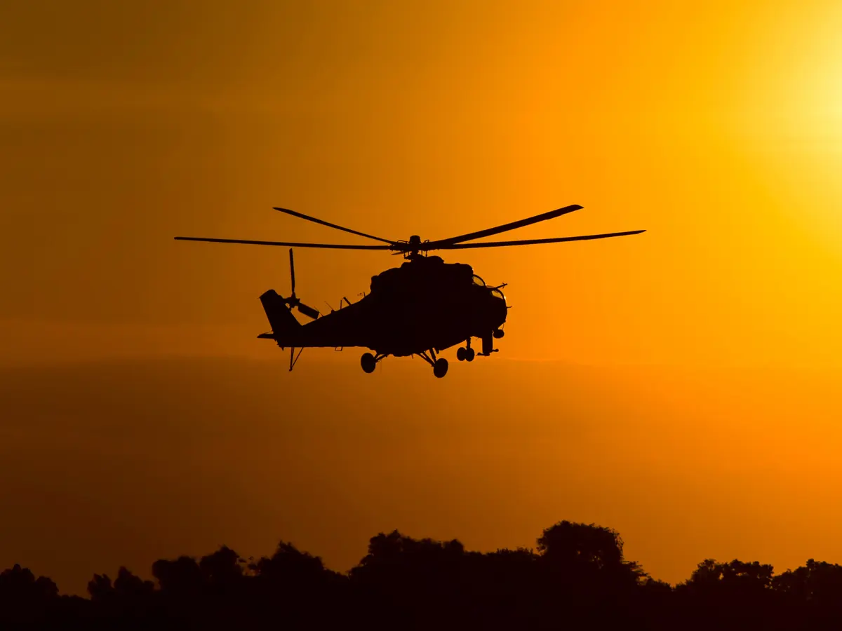 Defence aircraft on runway at sunrise